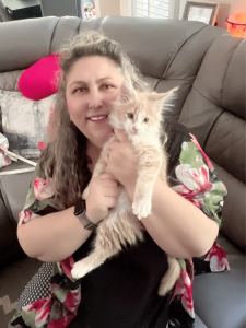 lady with her new maine coon kitten